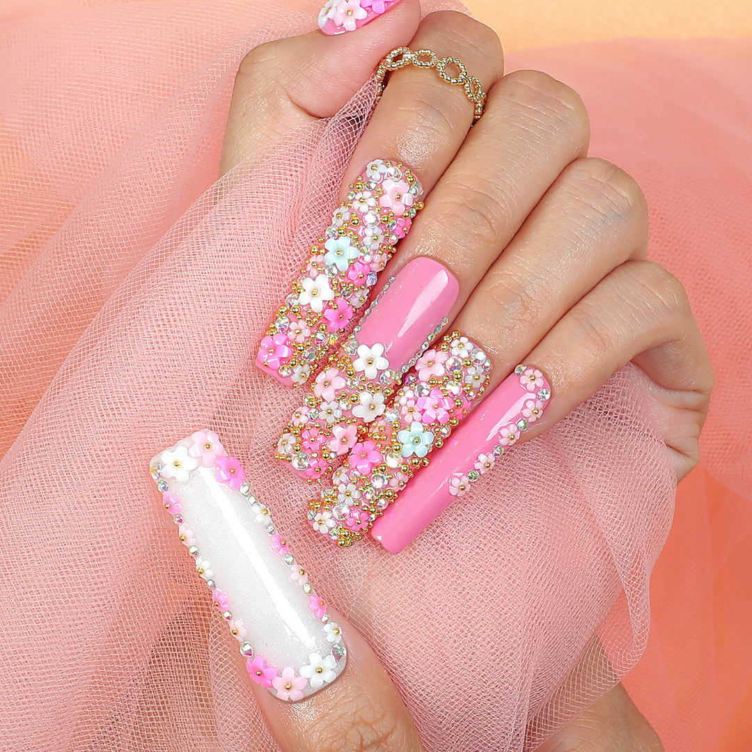 Artificial nail set with floral decorations and glitter accents Kalsten