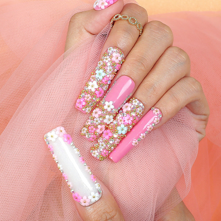 Artificial nail set with floral decorations and glitter accents Kalsten