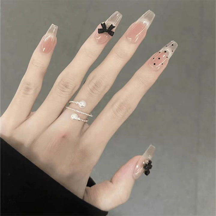 Artificial nails with playful bow design Kalsten