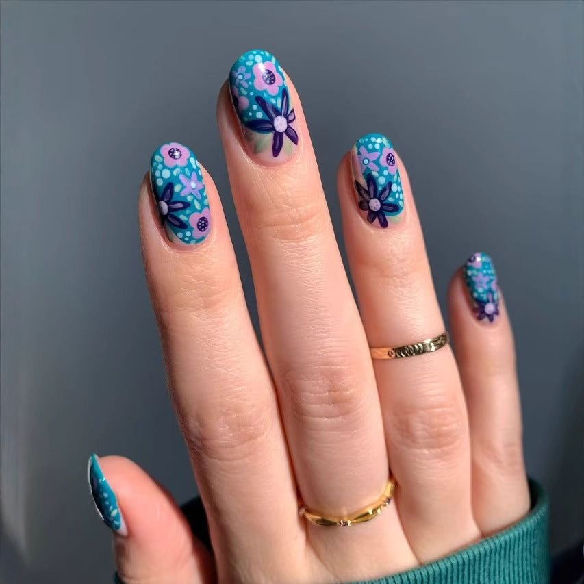 Nail art set with floral accents and vibrant patterns Kalsten