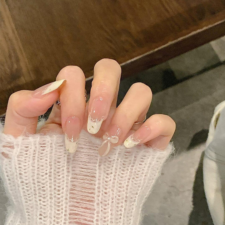Artificial nails with elegant tip embellishment and romantic details Kalsten