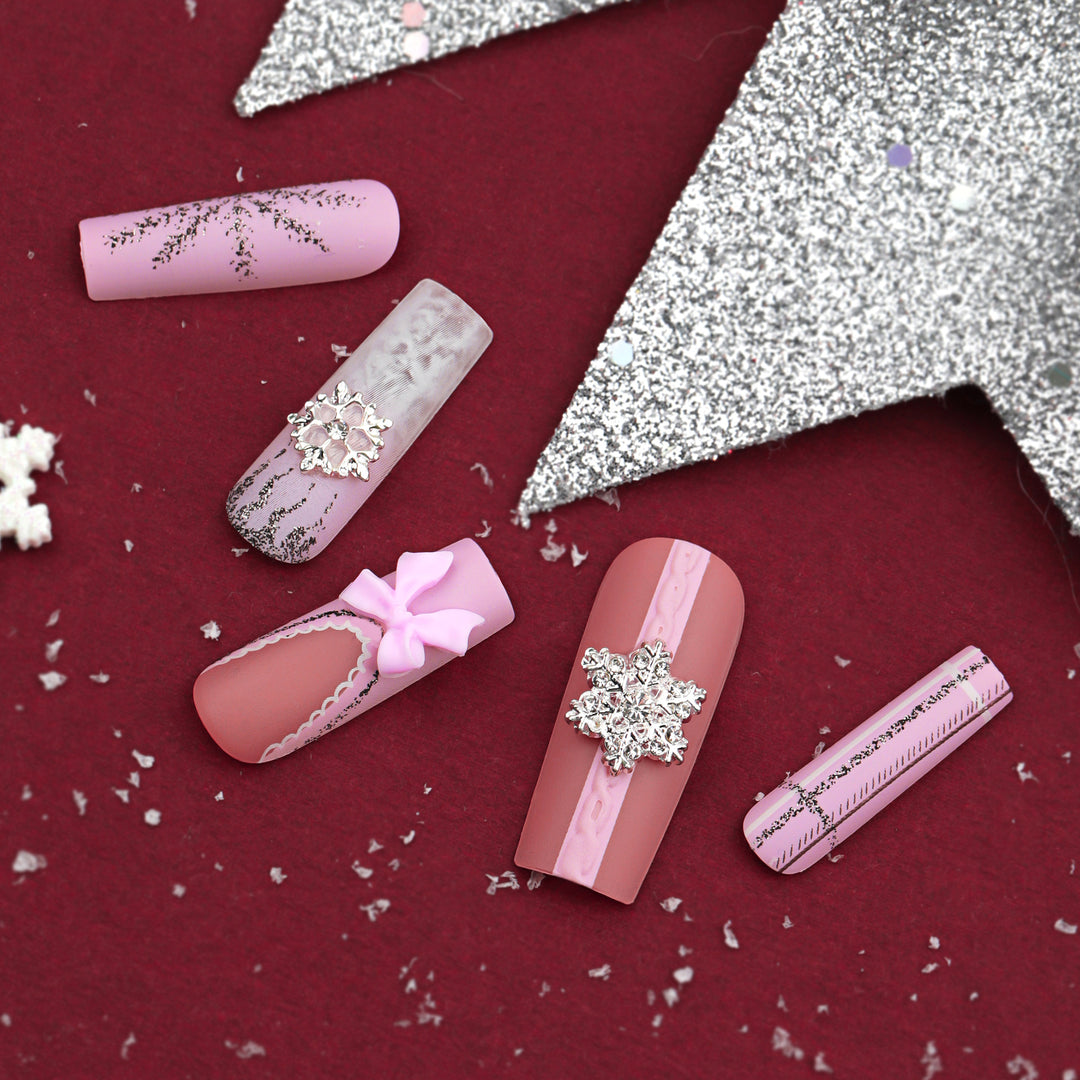 Artful nail extensions with festive decorations Kalsten
