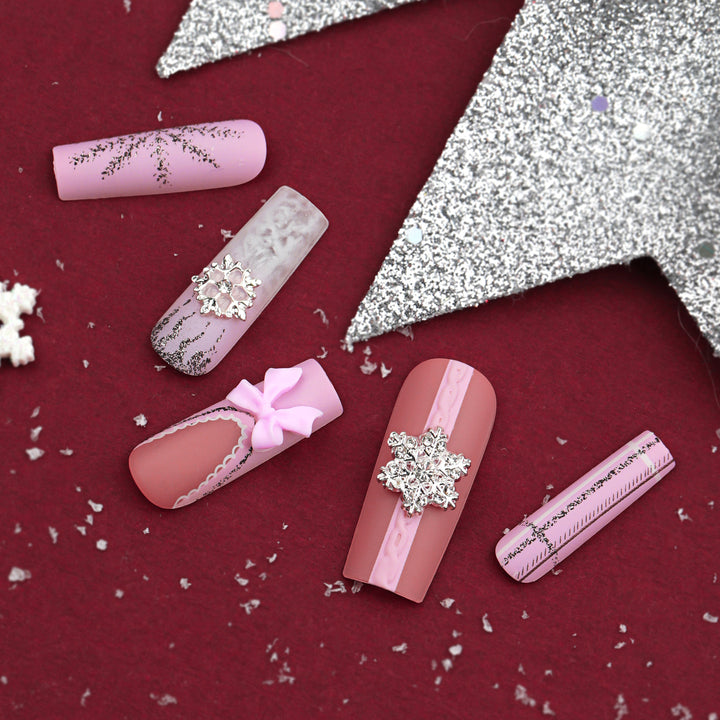 Artful nail extensions with festive decorations Kalsten