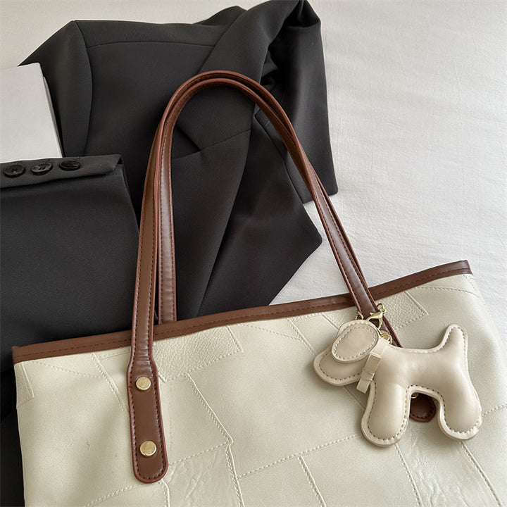 Stylish Textured Tote Bag with Decorative Charm