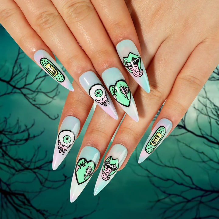 Artistic stiletto nails with creative designs and intricate detailing Kalsten