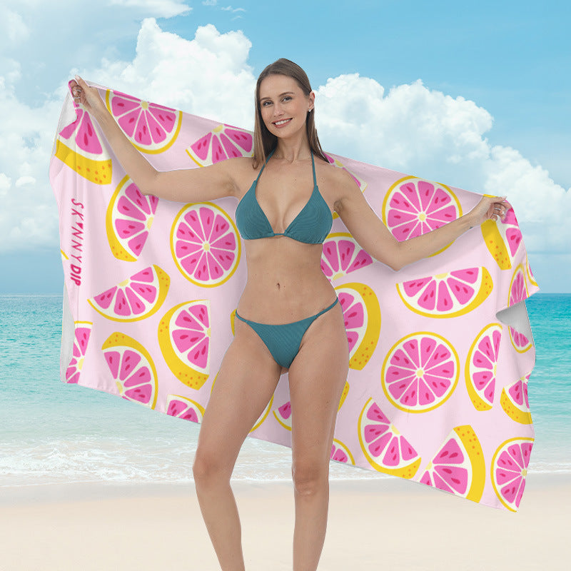 Beach towel with vibrant tropical plant motif Kalsten