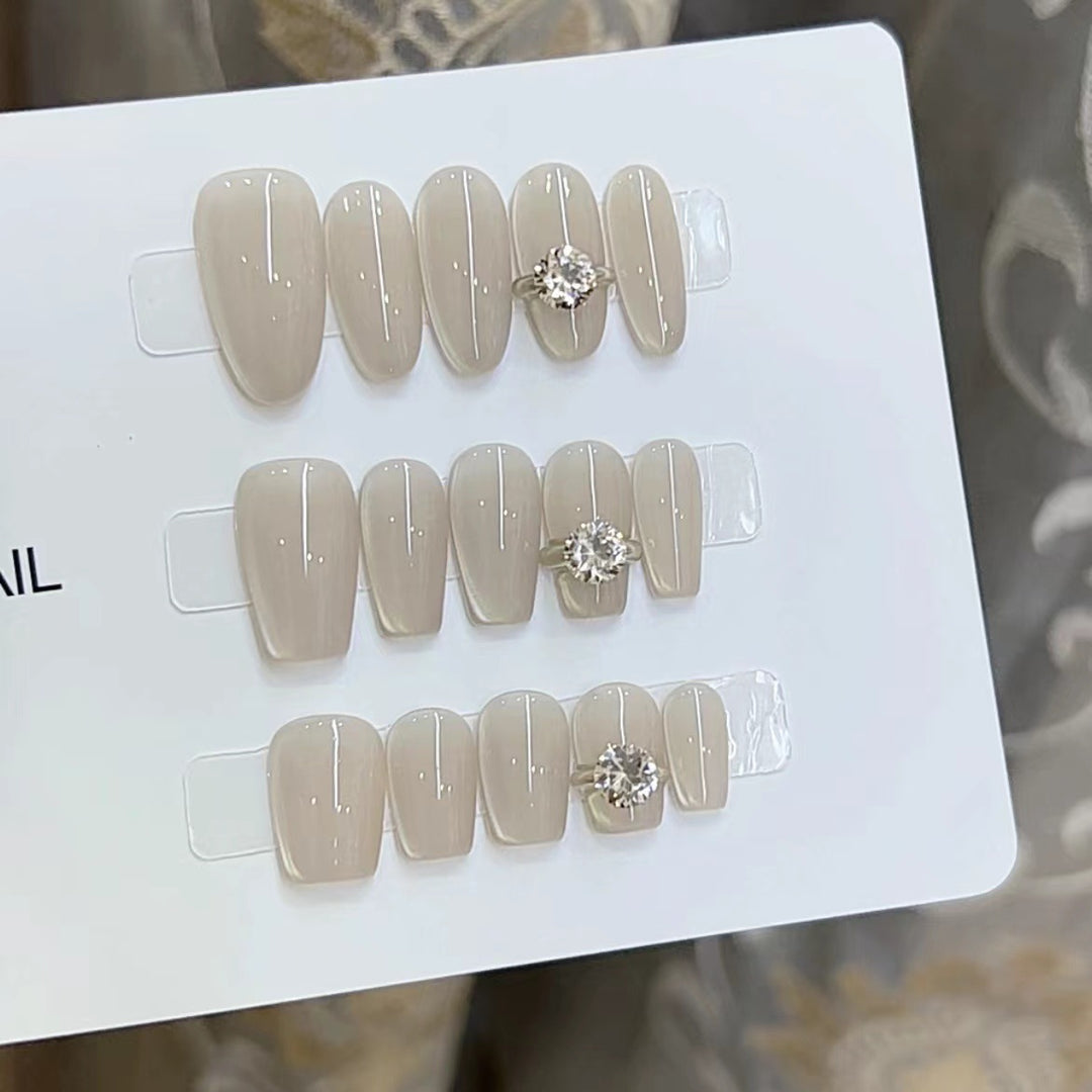Elegant Press-On Nail Art with Jewel Accents Kalsten
