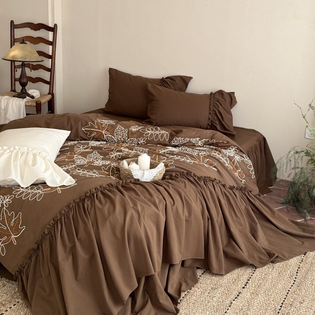 Bedding set with embroidered leaf pattern, ruffled bed skirt and ruffled pillow
