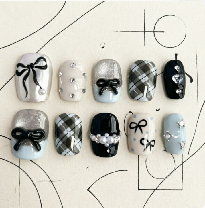Artificial nails with elegant bows and rhinestones Kalsten