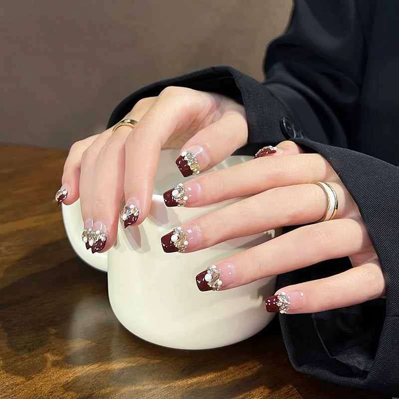 Acrylic nail set with elegant glitter and flower accents Kalsten