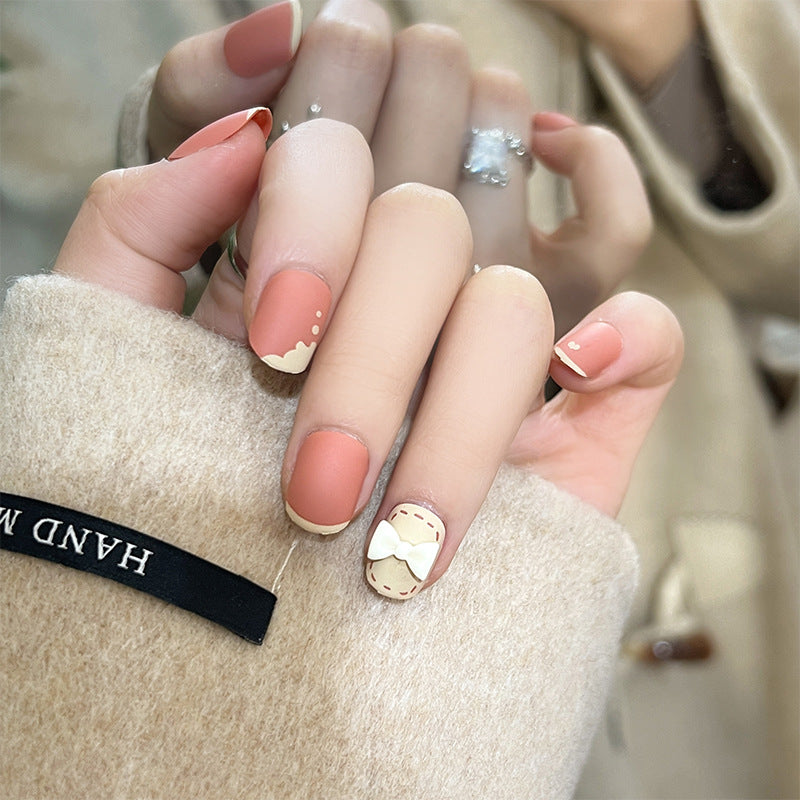 Artistic nail nails with decorative bow designs and French tips Kalsten
