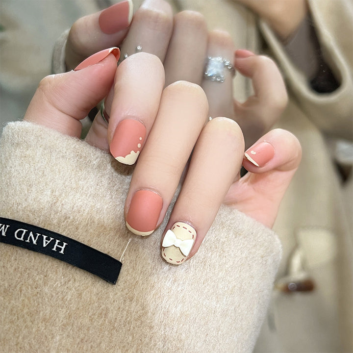 Artistic nail nails with decorative bow designs and French tips Kalsten