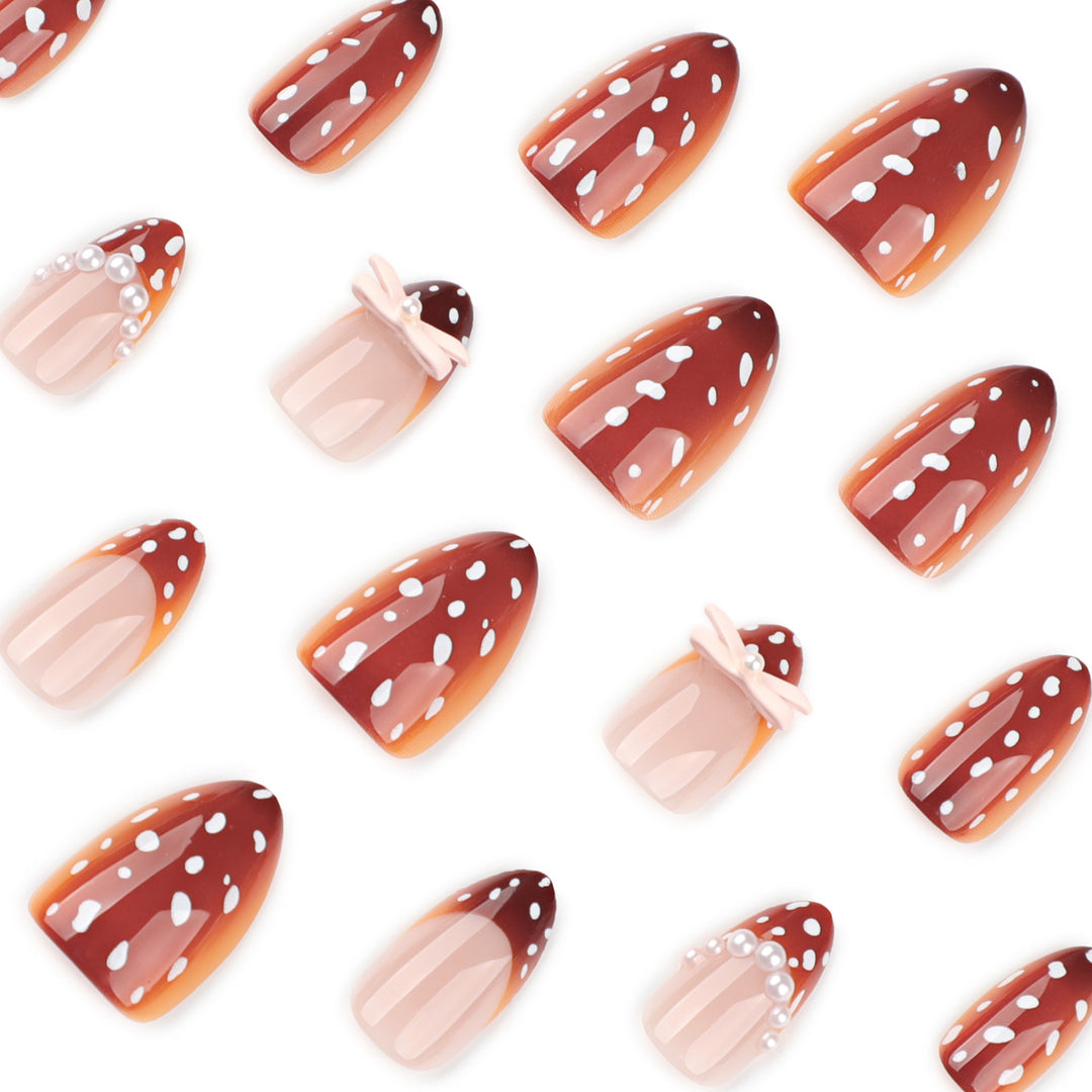 Artificial nail art with dot pattern and bow accents Kalsten