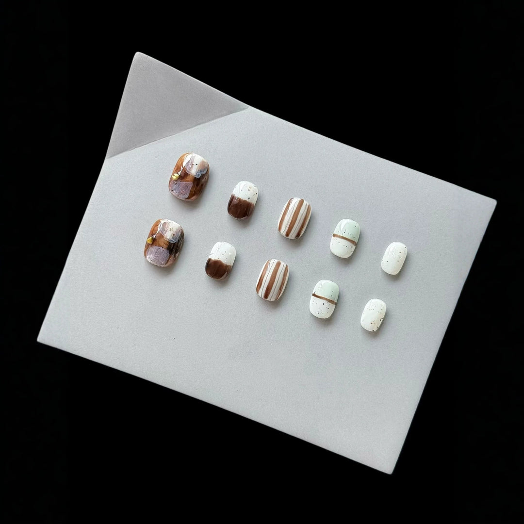 Artistic Press-On Nail Set with Geometric Patterns and Glossy Finish