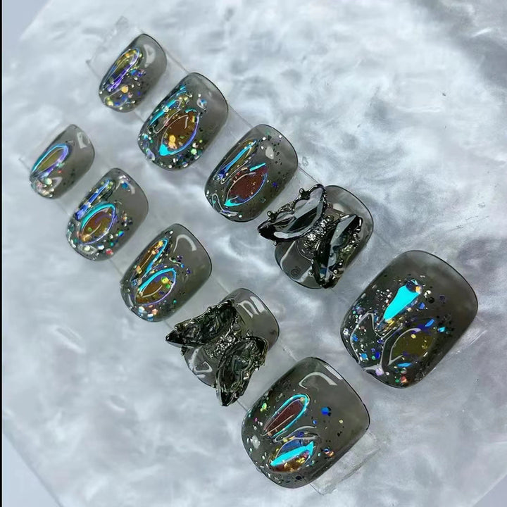 Elegant nail design with bow and rhinestone details Kalsten