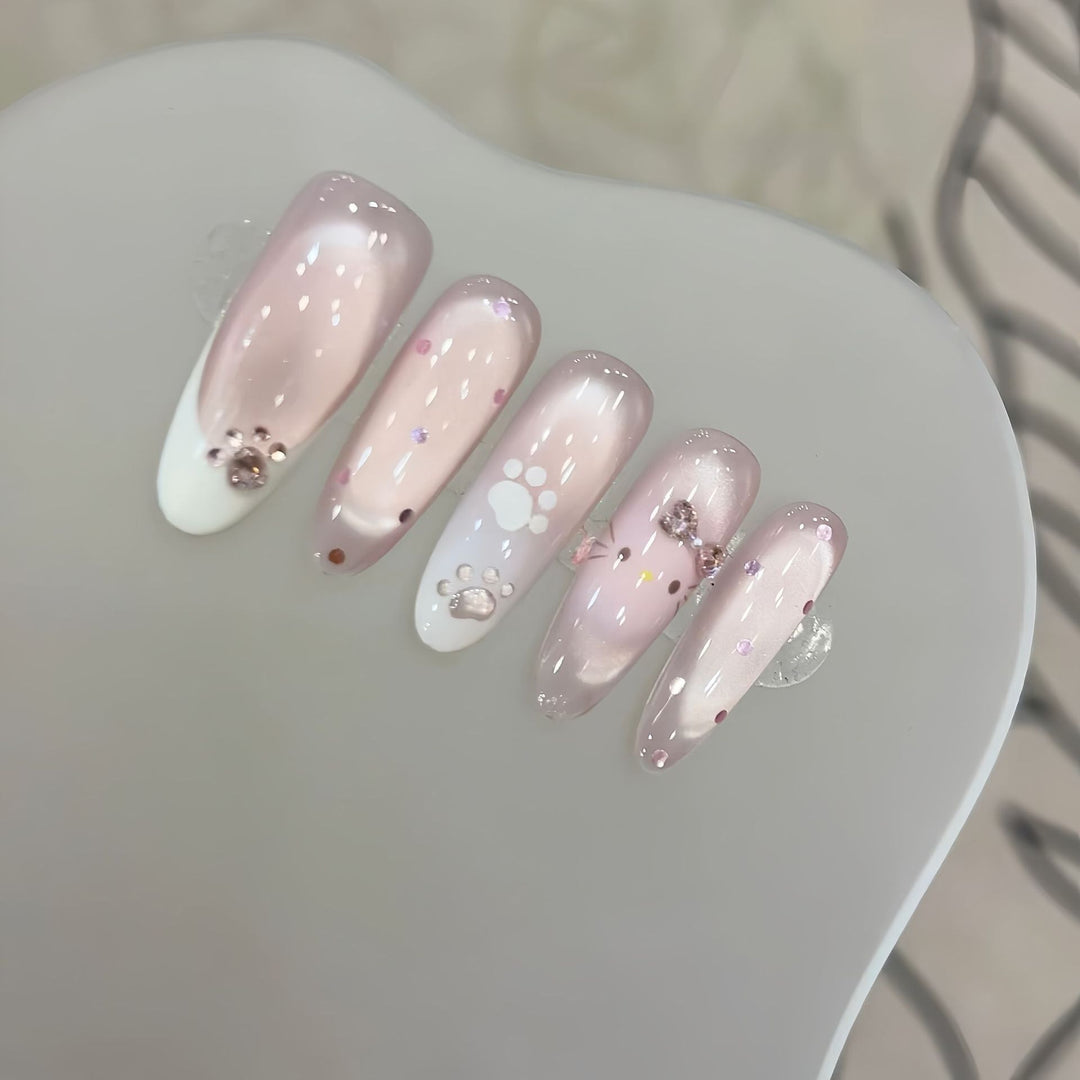 Artificial nail tips with playful penguin and paw print design Kalsten
