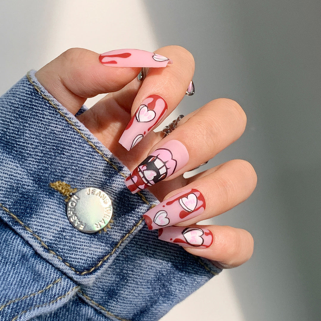 Artificial nail art with heart-shaped design and matte finish Kalsten