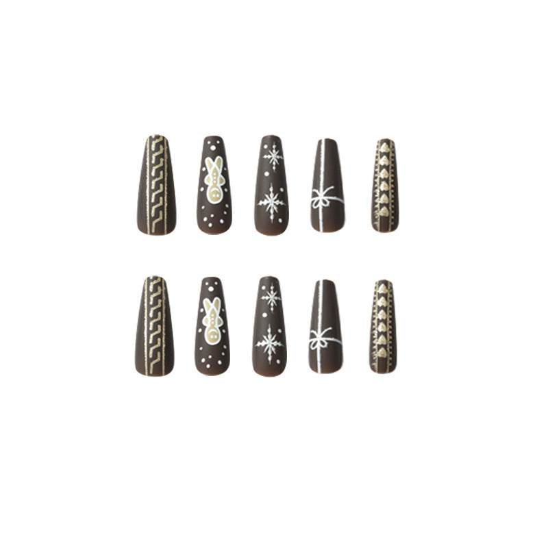 Artificial nail art with festive gingerbread design Kalsten