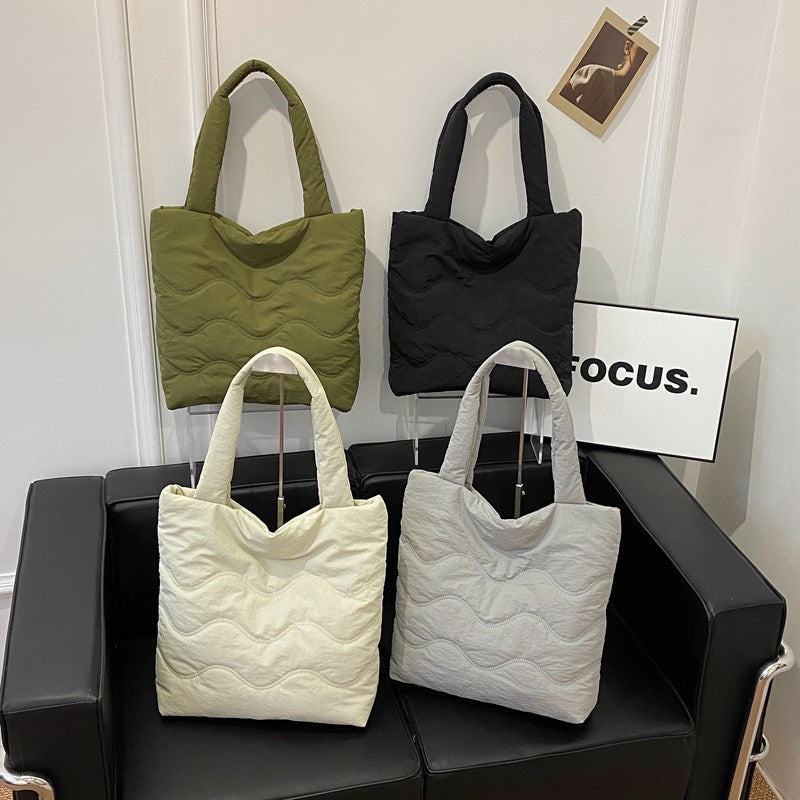 Padded shoulder bag with wave design Kalsten