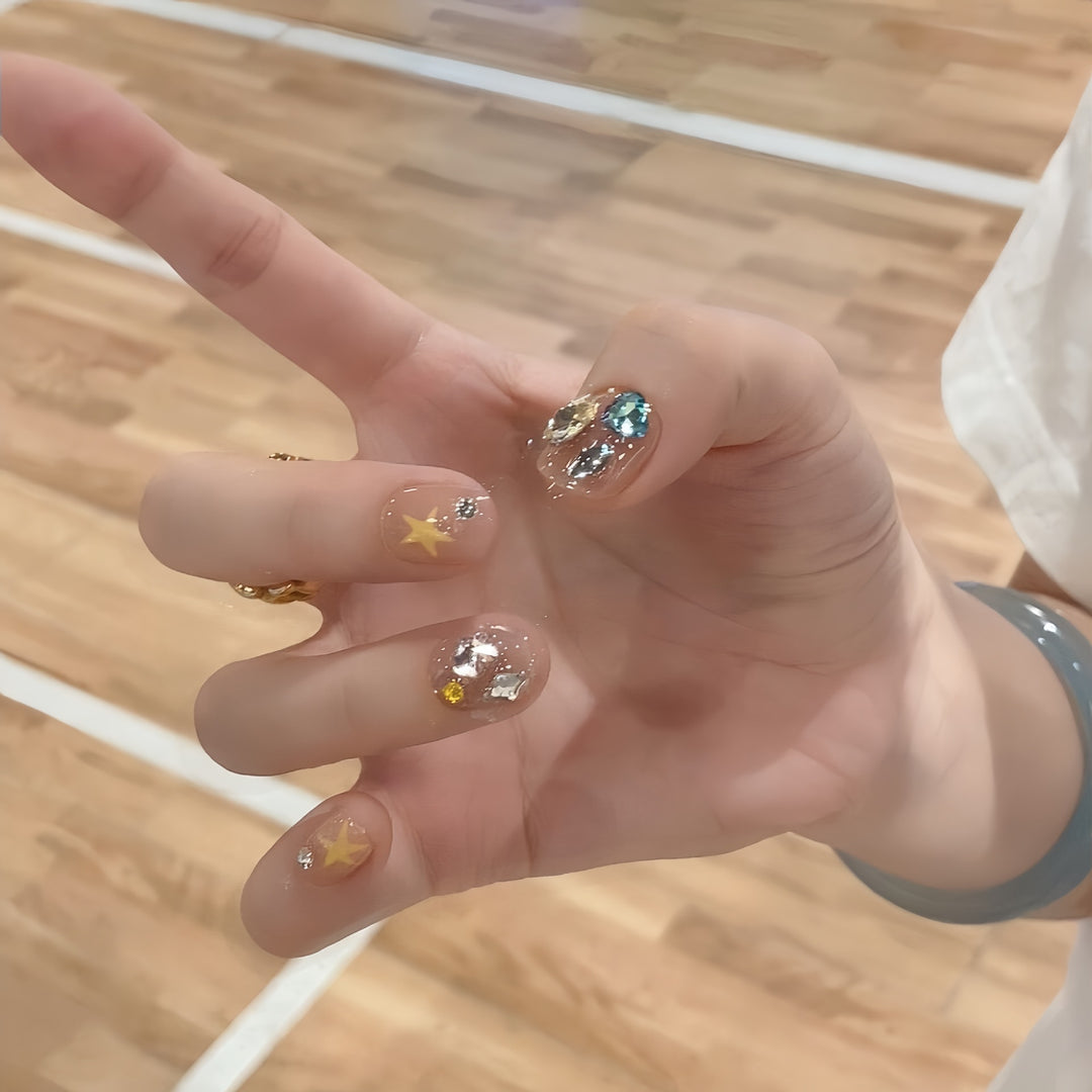Glittering nail tips with elegant jewelry accents Kalsten