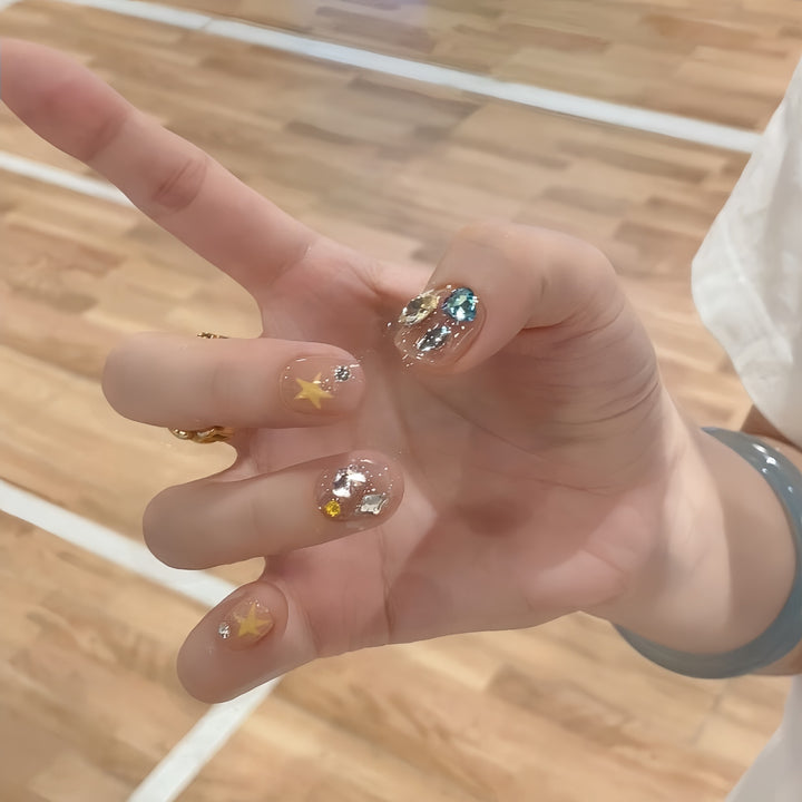 Glittering nail tips with elegant jewelry accents Kalsten