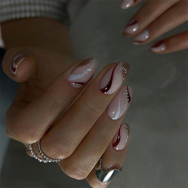 Elegant Nail Art with Modern Wave Pattern and Glitter Accents Kalsten