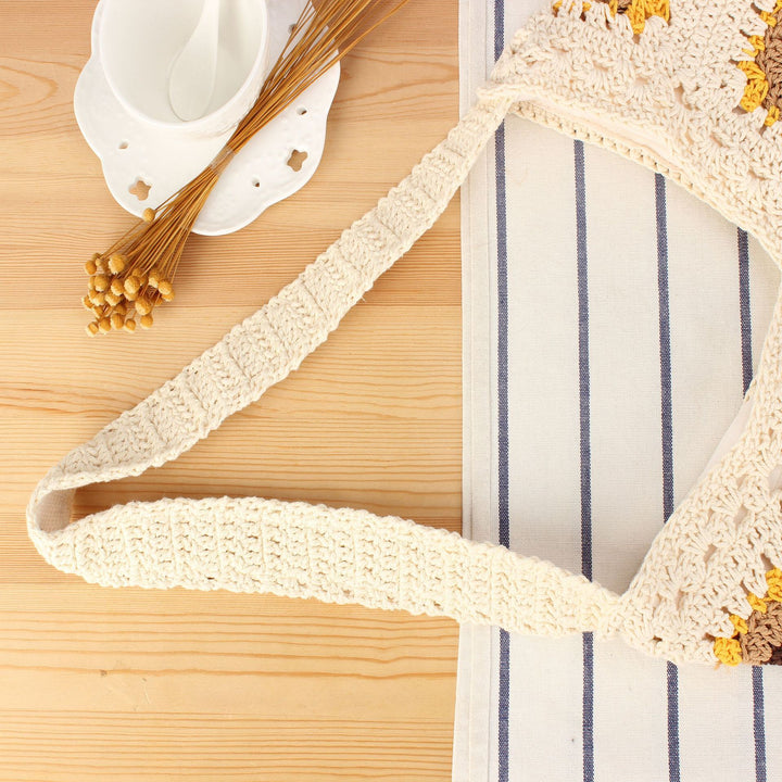 Crochet shoulder bag with playful sunflower pattern Kalsten