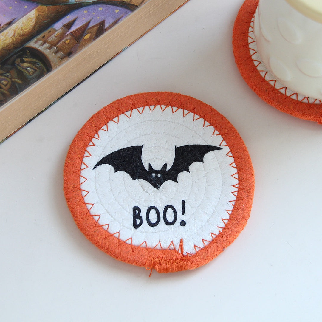 Round felt and cotton coasters with embroidered Halloween haunted house motif