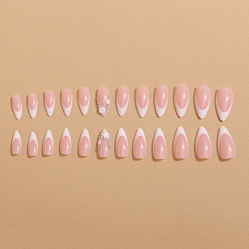 Artificial nails with elegant French tips and rhinestone details Kalsten