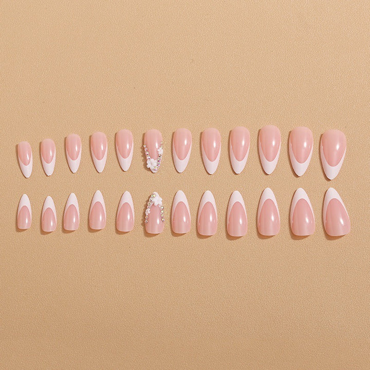 Artificial nails with elegant French tips and rhinestone details Kalsten