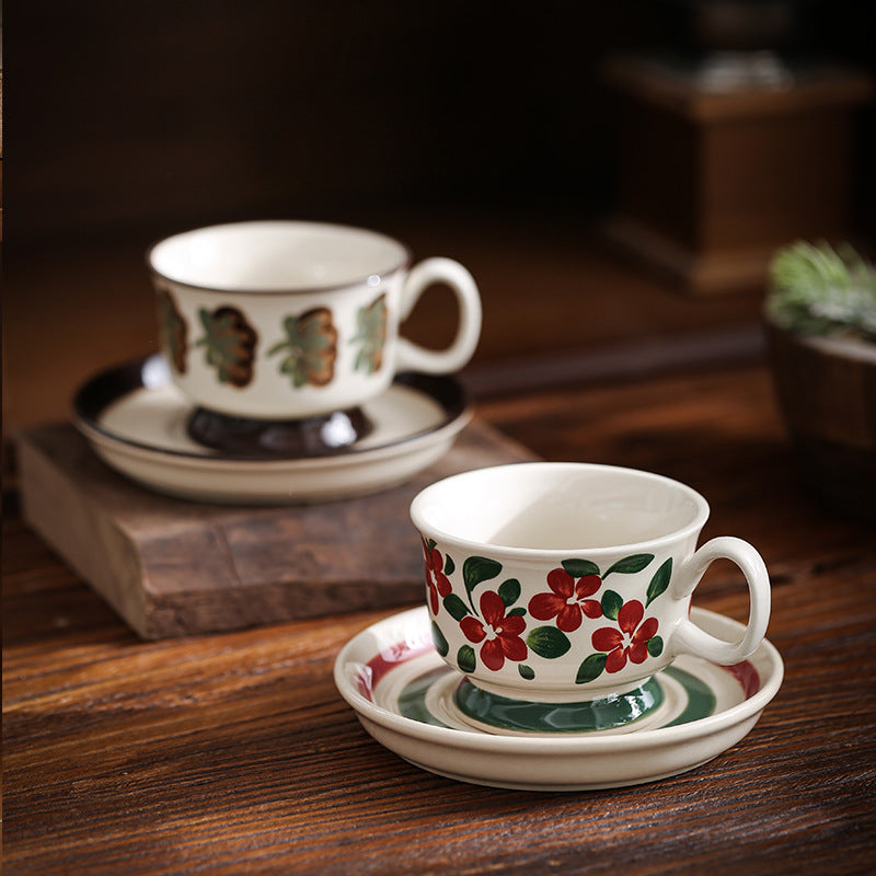 Ceramic coffee cup set with saucer and hand-painted leaf ornament