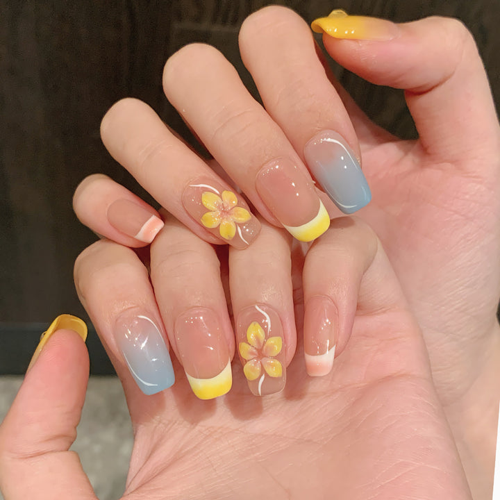 Artistic Press-On Nail Set with Floral Designs and Ombre Accents