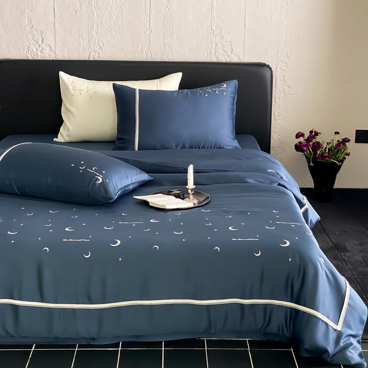 Silky shiny satin bed linen set with subtle moon and star motif