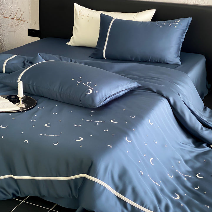 Silky shiny satin bed linen set with subtle moon and star motif