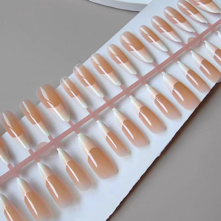 Artificial nails in the elegant French tip design Kalsten