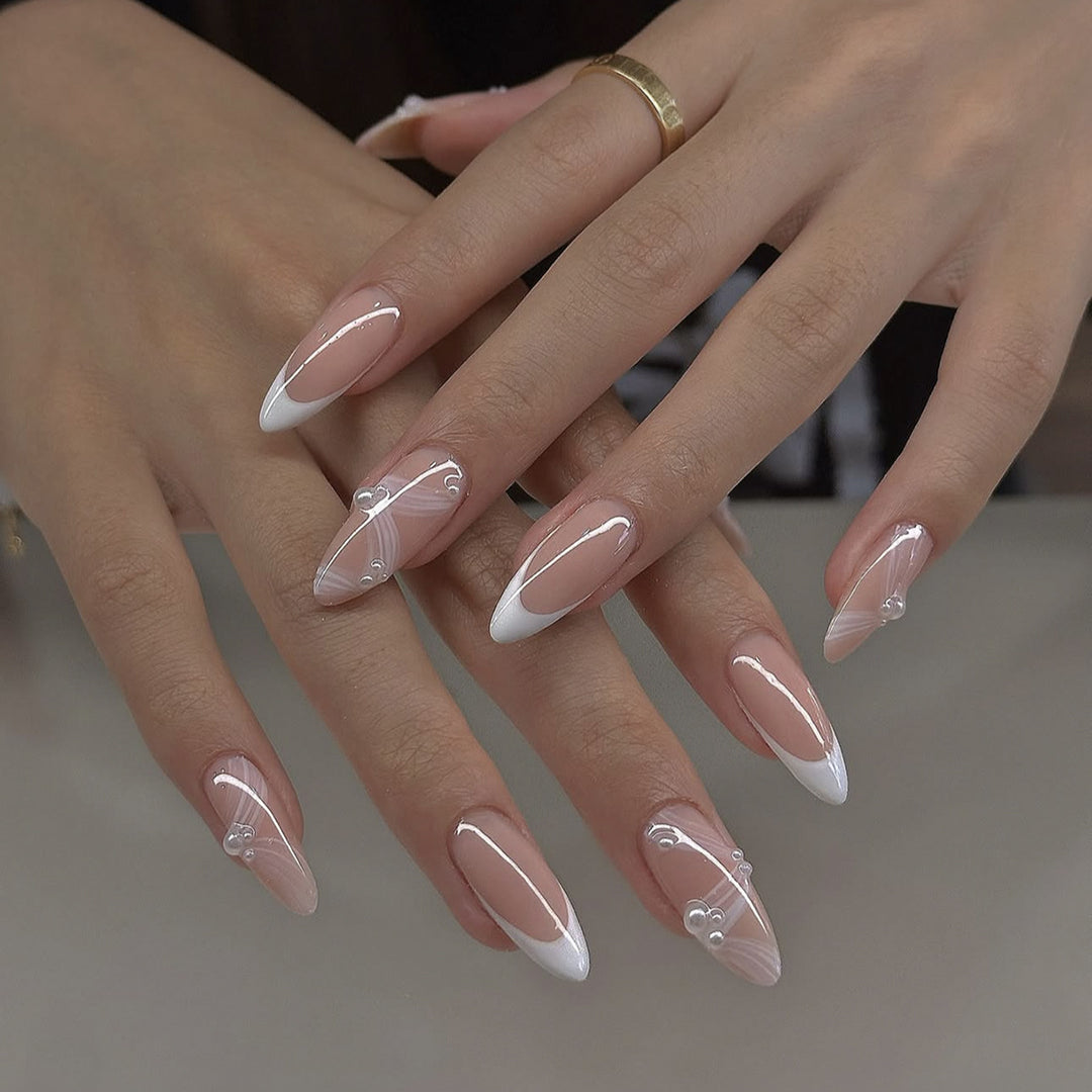 Creative acrylic nail set with elegant tips and glitter decorations Kalsten
