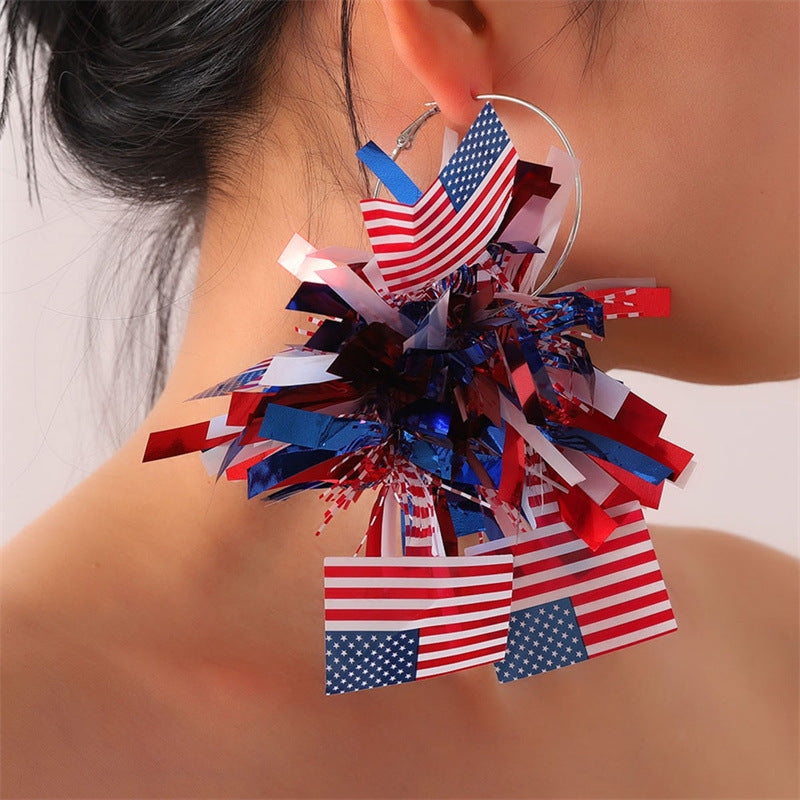 Unisex nan festive metallic tinsel pom pom hoop earrings Kalsten
