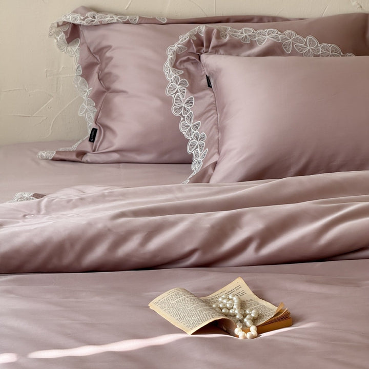 Luxurious cotton satin bed linen set with fine lace border