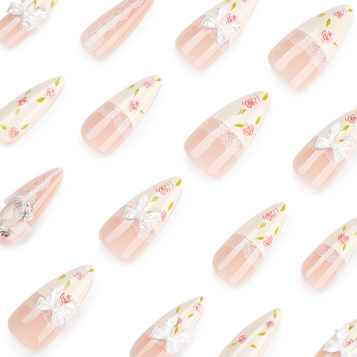 Artful stiletto nails with floral accents and glitter accents Kalsten