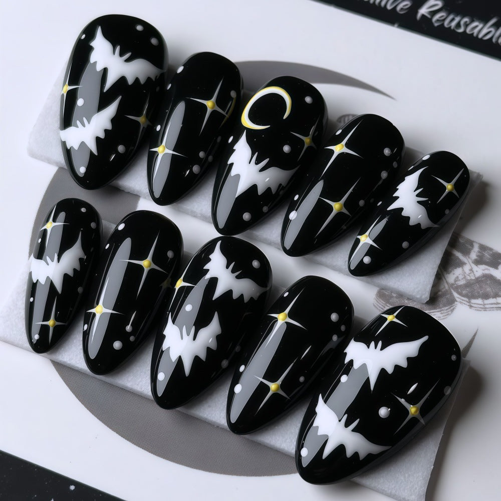 Artificial nails in creative Halloween bat design Kalsten