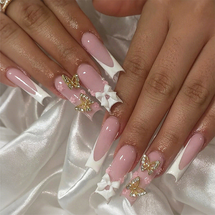Artificial nail set with elegant butterfly and bow accents Kalsten