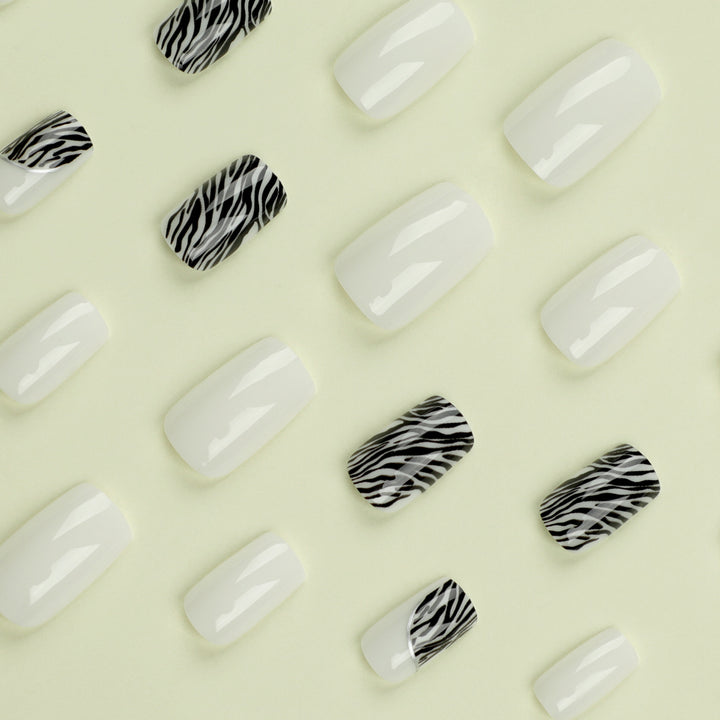 Artful nail extensions with stylish zebra pattern Kalsten