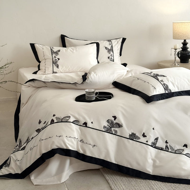 Luxurious cotton satin bedding set with butterfly embroidery and contrasting piping Kalsten