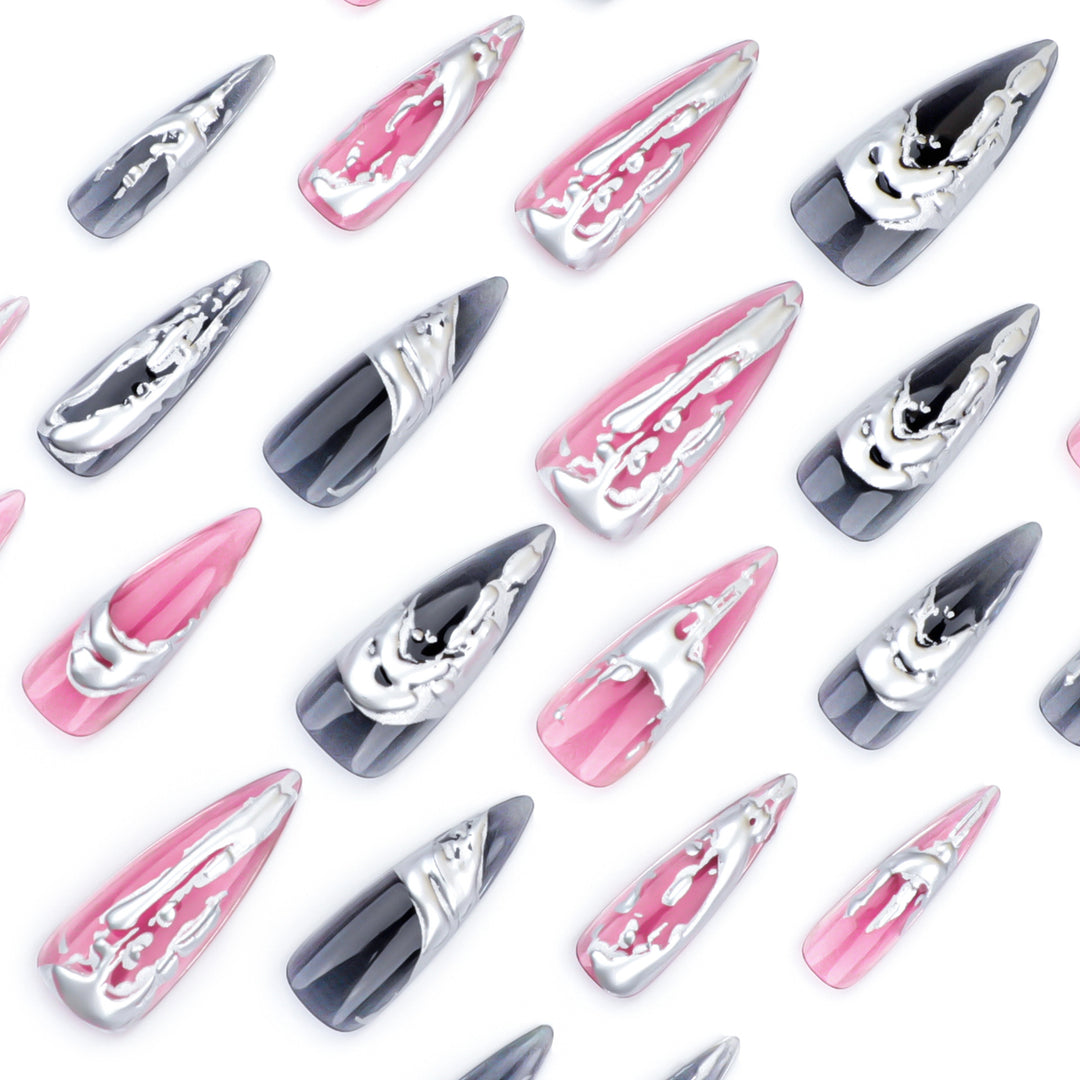 Creative stiletto nails with unique metallic details Kalsten