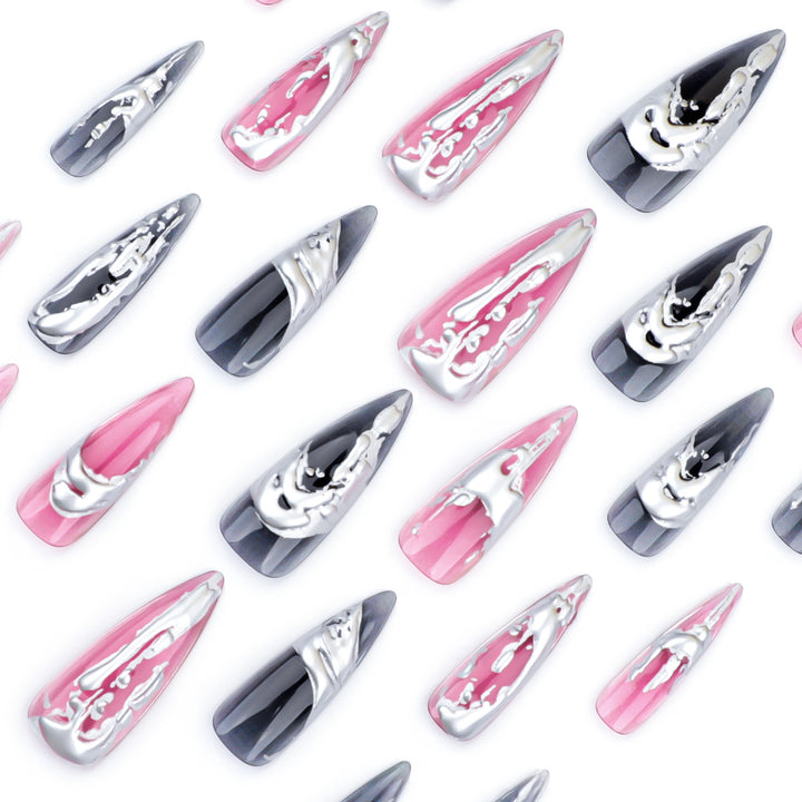 Creative stiletto nails with unique metallic details Kalsten