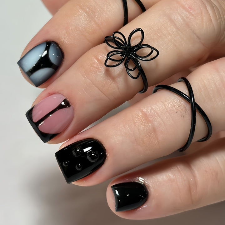 Artificial nails with elegant black and pastel accent design Kalsten