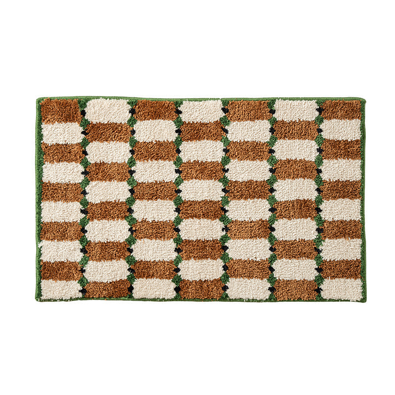 Hand-tufted bathroom mat with a velvety pile, non-slip latex backing, and geometric honeycomb check pattern Kalsten
