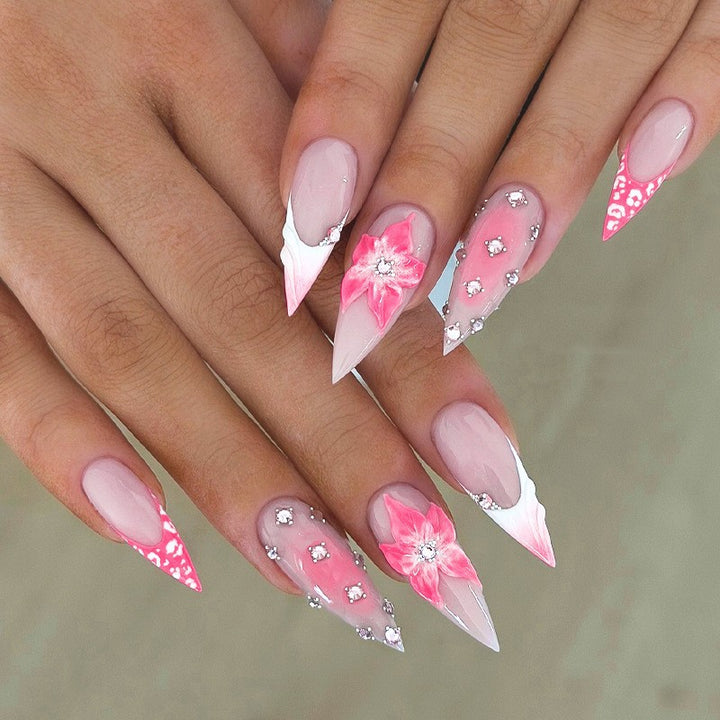Nail art set with elegant floral embellishments and glamorous accents Kalsten