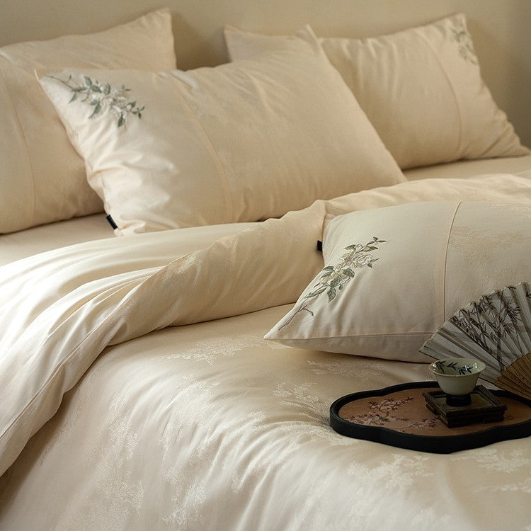 Luxurious satin bedding set with delicate floral embroidery