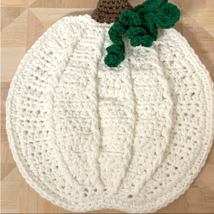 Hand-crocheted pumpkin pot holder and table mat made of cotton yarn